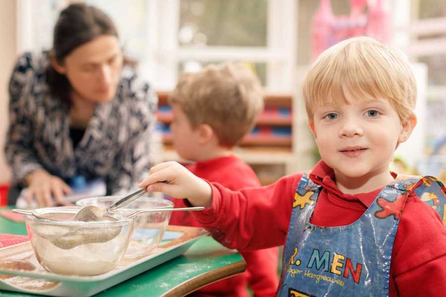 boy cooking montessori boy in class cooking